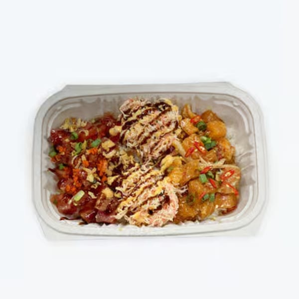 A Big Island Poke bowl with three sections of different poke, rice, and toppings.