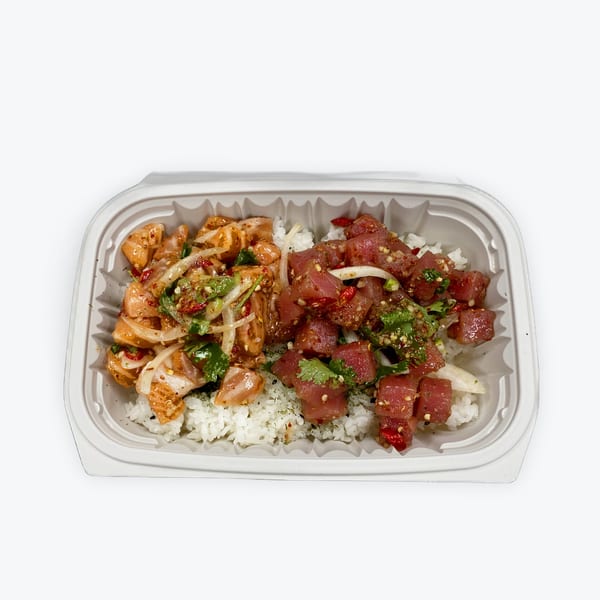 Big Island Poke bowl with salmon and tuna poke, onions, and cilantro over white rice.